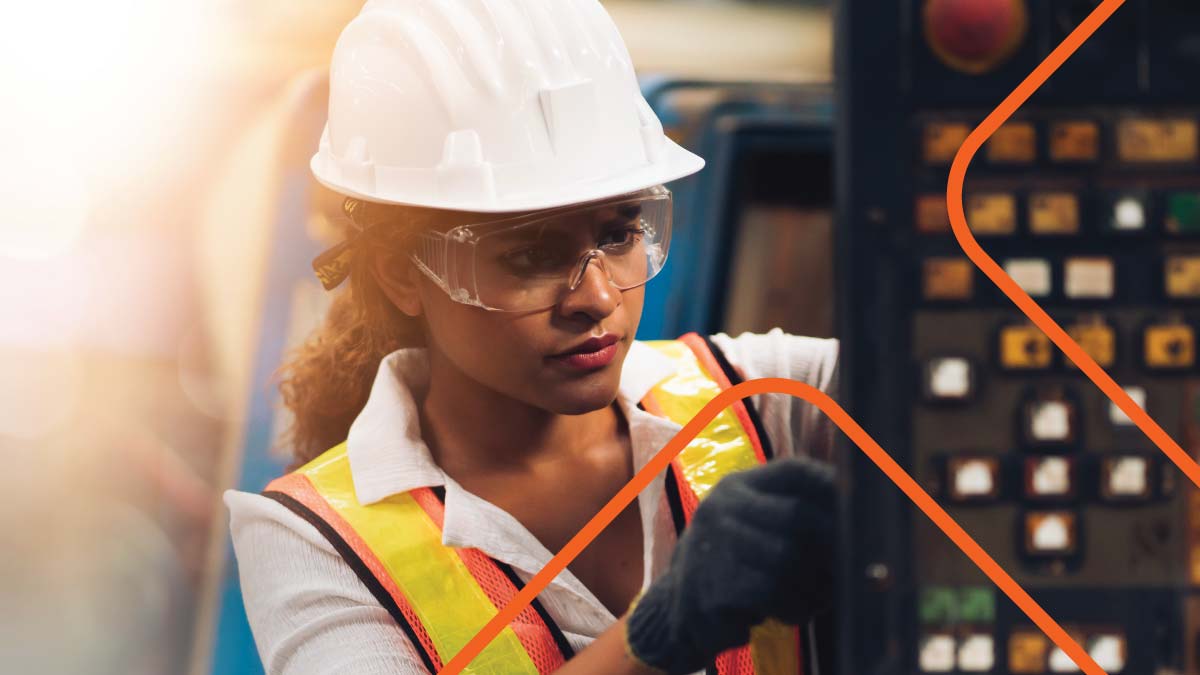 Woman wearing hard hat working with circuit breaker